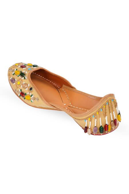 Buy NR By Nidhi Rathi Beige Embellished Navaratnam Mojaris Buy_NR By Nidhi Rathi_Beige Embellished Navaratnam Mojaris