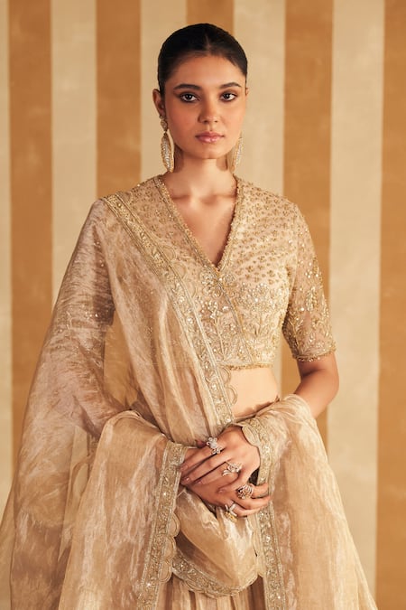 Ridhi Mehra_Gold Net, Tissue Sequins, Beads, Zari V-neck Floral Embroidered Lehenga Set _at_Aza_Fashions