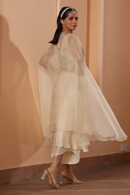 Shop Saisha Ivory Silk Embroidery V-neck Cape With Dhoti Set at Aza Fashions Shop_Saisha_Ivory Silk Embroidery V-neck Cape With Dhoti Set _at_Aza_Fashions