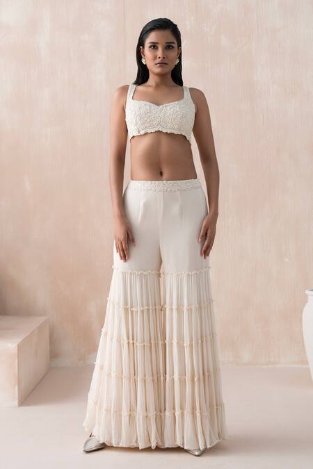 Saisha Ivory Organza, Georgette Sequins, Beads, Asymmetric Cape Tiered Gharara Set Online at Aza Fashions Saisha_Ivory Organza, Georgette Sequins, Beads, Asymmetric Cape Tiered Gharara Set _Online_at_Aza_Fashions