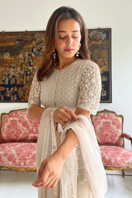 Saisha Ivory Net Cut Work, Sequins, Embroidery Round Neck Peplum Kurta Sharara Set Online at Aza Fashions Saisha_Ivory Net Cut Work, Sequins, Embroidery Round Neck Peplum Kurta Sharara Set _Online_at_Aza_Fashions