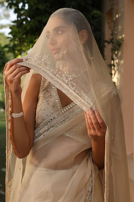 Saisha Ivory Silk, Organza Sequins, Mirrors V-neck Border Embroidered Saree With Blouse Online at Aza Fashions Saisha_Ivory Silk, Organza Sequins, Mirrors V-neck Border Embroidered Saree With Blouse _Online_at_Aza_Fashions