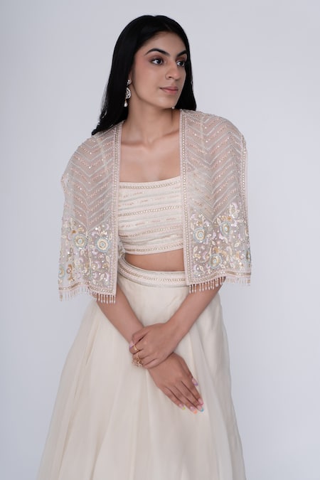Saisha Ivory Organza, Silk Sequins, Embroidery Crew Neck Floral Short Cape And Skirt Set Online at Aza Fashions Saisha_Ivory Organza, Silk Sequins, Embroidery Crew Neck Floral Short Cape And Skirt Set _Online_at_Aza_Fashions