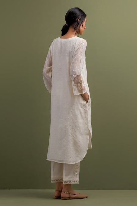 Shop Anantaa By Roohi Ivory Chanderi Sequins, Embroidery Split V-neck Thread High Low Kurta With Pant at Aza Fashions Shop_Anantaa By Roohi_Ivory Chanderi Sequins, Embroidery Split V-neck Thread High Low Kurta With Pant _at_Aza_Fashions