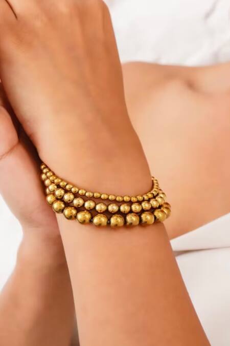 Kastiya Jewels_Gold Plated Toned Stack Bracelet Embellished With Natural Hematite_at_Aza_Fashions