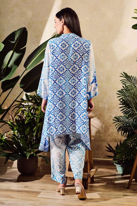 Shop Rainas Blue Cotton, Silk Tassels Mandarin Botanical Print Asymmetric Kurta With Pant at Aza Fashions Shop_Rainas_Blue Cotton, Silk Tassels Mandarin Botanical Print Asymmetric Kurta With Pant_at_Aza_Fashions