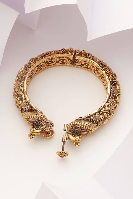 SUIKALA Gold Plated Stones Carved Peacock Temple Kada Online at Aza Fashions SUIKALA_Gold Plated Stones Carved Peacock Temple Kada_Online_at_Aza_Fashions