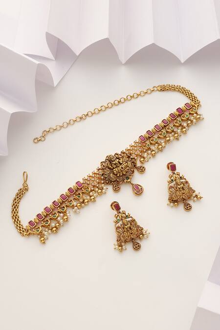Shop SUIKALA Gold Plated Pearls, Stones Laxmiji Carved Choker Necklace Set at Aza Fashions Shop_SUIKALA_Gold Plated Pearls, Stones Laxmiji Carved Choker Necklace Set_at_Aza_Fashions