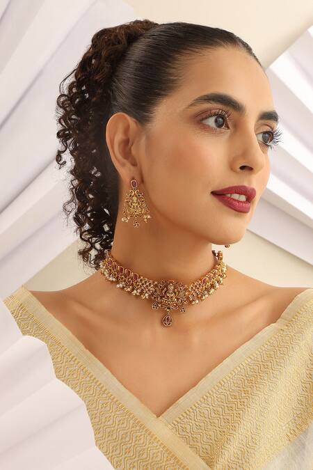 Shop SUIKALA Gold Plated Pearls, Stones Laxmiji Carved Choker Necklace Set Online at Aza Fashions Shop_SUIKALA_Gold Plated Pearls, Stones Laxmiji Carved Choker Necklace Set_Online_at_Aza_Fashions