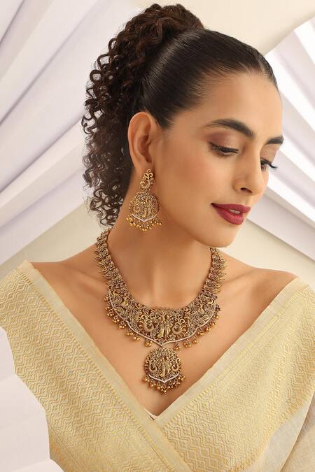 Shop_SUIKALA_Gold Plated Stones Radha-krishna Carved Long Temple Necklace Set_Online_at_Aza_Fashions