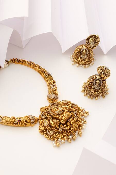 SUIKALA Gold Plated Pearls, Stones Laxmiji Carved Temple Hasli Necklace Set Online at Aza Fashions SUIKALA_Gold Plated Pearls, Stones Laxmiji Carved Temple Hasli Necklace Set _Online_at_Aza_Fashions