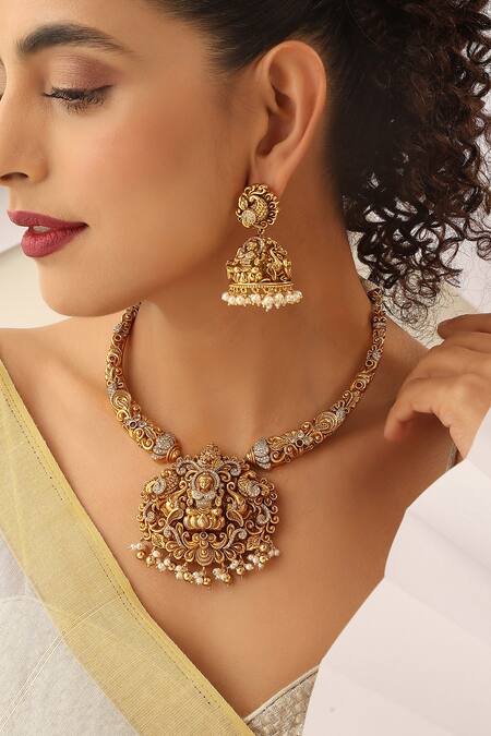 Buy SUIKALA Gold Plated Pearls, Stones Laxmiji Carved Temple Hasli Necklace Set Online at Aza Fashions Buy_SUIKALA_Gold Plated Pearls, Stones Laxmiji Carved Temple Hasli Necklace Set _Online_at_Aza_Fashions