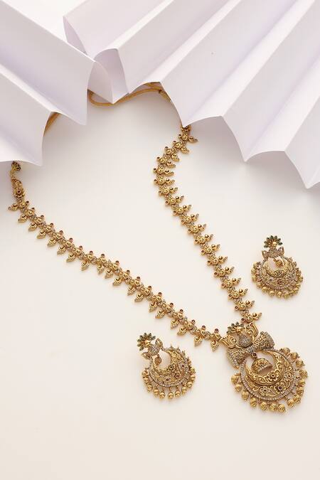 Shop SUIKALA Gold Plated Stones, Beads Peacock Studded Temple Long Necklace Set at Aza Fashions Shop_SUIKALA_Gold Plated Stones, Beads Peacock Studded Temple Long Necklace Set_at_Aza_Fashions