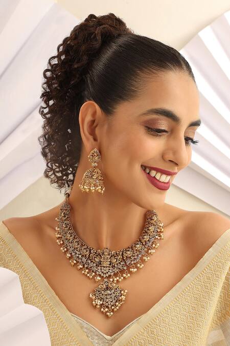 Shop_SUIKALA_Gold Plated Goddess Carved Motif Temple Necklace Set_Online_at_Aza_Fashions