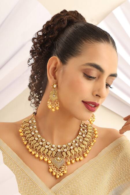 Shop_SUIKALA_Gold Plated Pearls Paisley Carved Motif Necklace Set _Online_at_Aza_Fashions