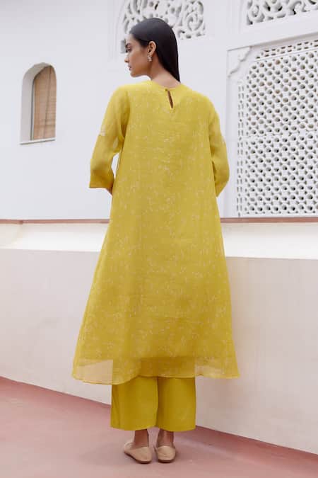 Shop Vaayu Yellow Muslin, Cotton Embroidery Round Neck Floral Applique Kurta And Pant Set at Aza Fashions Shop_Vaayu_Yellow Muslin, Cotton Embroidery Round Neck Floral Applique Kurta And Pant Set _at_Aza_Fashions