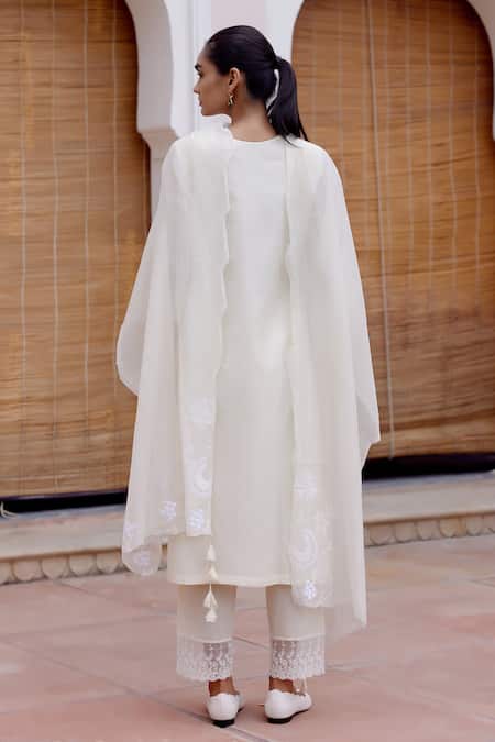 Shop Vaayu White Muslin Embroidery, Tassels Round Neck Floral Applique Kurta Pant Set at Aza Fashions Shop_Vaayu_White Muslin Embroidery, Tassels Round Neck Floral Applique Kurta Pant Set _at_Aza_Fashions