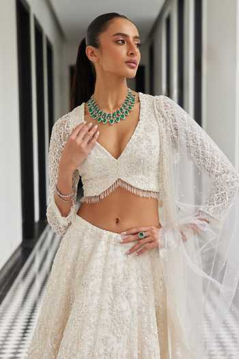 Istya_Ivory Net Sequins, Embroidery Plunge Neck Floral Hand Lehenga Set _Online_at_Aza_Fashions