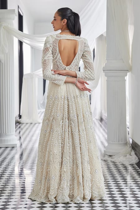 Shop Istya Ivory Net Pearls, Stones Plunge Neck Embellished Jacket And Skirt Set at Aza Fashions Shop_Istya_Ivory Net Pearls, Stones Plunge Neck Embellished Jacket And Skirt Set _at_Aza_Fashions