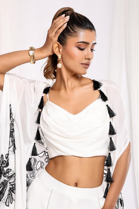 Ellemora Fashions White Crepe Tassels Cowl Neck, V-neck, Leaf Hand Embroidered Shrug And Pant Set at Aza Fashions Ellemora Fashions_White Crepe Tassels Cowl Neck, V-neck, Leaf Hand Embroidered Shrug And Pant Set _at_Aza_Fashions