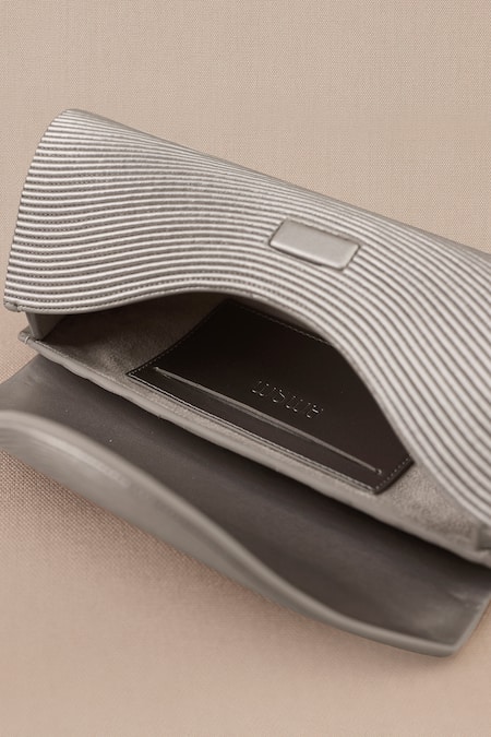 Ampm_Silver Textured Reba Metallic Clutch _at_Aza_Fashions