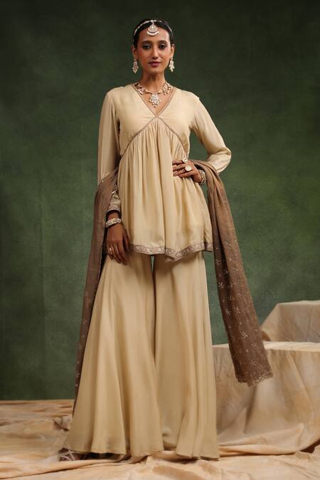 Charu Makkar_Beige Muslin, Silk Embroidery Over The Taupe Gathered Peplum Kurta Gharara Set _at_Aza_Fashions
