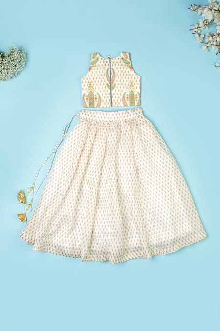 Shop_Yuvraani Jaipur_Ivory Chanderi, Net Embroidery, Tassels Floral Print Lehenga Blouse Set _at_Aza_Fashions