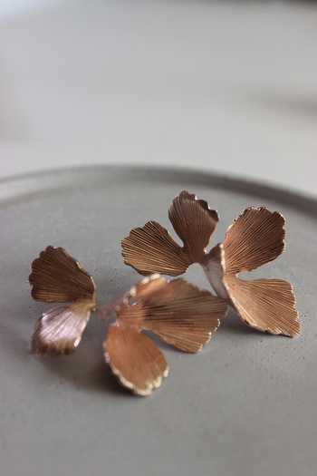 Buy_Heena Mittal_Gold Plated Textured Petal Stud Earrings _Online_at_Aza_Fashions