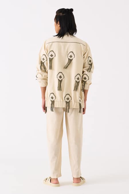 Shop Three Ivory Handloom Cotton Embroidered Thread Fringe Bomber Jacket at Aza Fashions Shop_Three_Ivory Handloom Cotton Embroidered Thread Fringe Bomber Jacket _at_Aza_Fashions