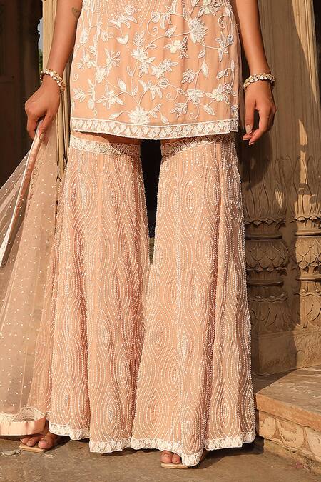 Shop Niamh By Kriti Pink Organza, Net, Satin Pearls, Beads, Floral Embroidered Kurta Gharara Set Online at Aza Fashions Shop_Niamh By Kriti_Pink Organza, Net, Satin Pearls, Beads, Floral Embroidered Kurta Gharara Set _Online_at_Aza_Fashions