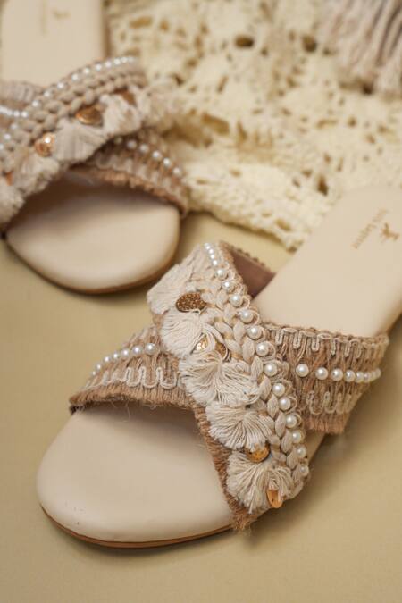 Buy_Jutti Express_Off White Boho Tassel And Pearl Embellished Cross Strap Flats _Online_at_Aza_Fashions