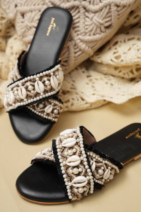 Jutti Express Black Cowrie Shells And Pearl Embellished Cross Strap Flats Online at Aza Fashions Jutti Express_Black Cowrie Shells And Pearl Embellished Cross Strap Flats _Online_at_Aza_Fashions