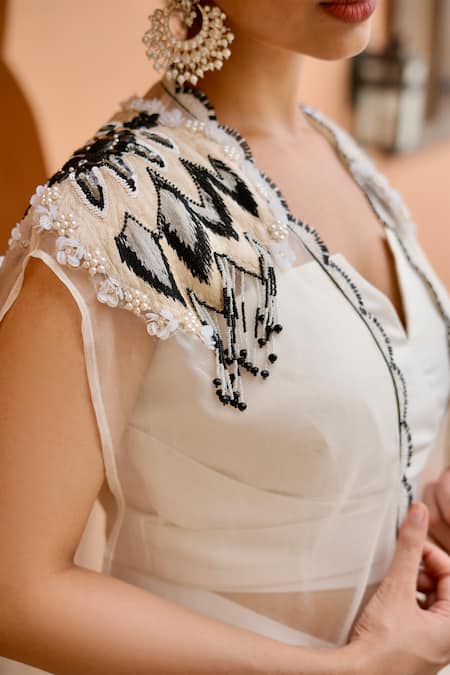 Shop Nidhi Kejriwal Off White Organza Cut Work, Embellished Draped Dhoti Skirt Set With Cape Online at Aza Fashions Shop_Nidhi Kejriwal_Off White Organza Cut Work, Embellished Draped Dhoti Skirt Set With Cape _Online_at_Aza_Fashions