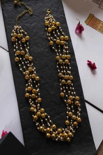 Shop Do Taara Gold Plated Shell Pearl Embellished Layered Necklace at Aza Fashions Shop_Do Taara_Gold Plated Shell Pearl Embellished Layered Necklace _at_Aza_Fashions