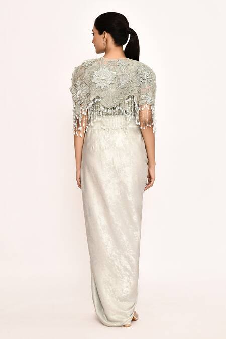 Shop_Eeksha_Ivory Lycra, Faux Leather Embroidery, Fringe Round Neck Floral Cape Skirt Set _at_Aza_Fashions