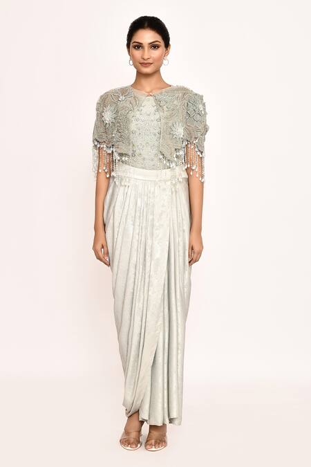 Shop_Eeksha_Ivory Lycra, Faux Leather Embroidery, Fringe Round Neck Floral Cape Skirt Set _Online_at_Aza_Fashions