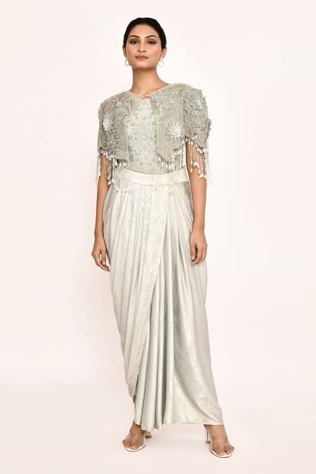 Shop Eeksha Ivory Lycra, Faux Leather Embroidery, Fringe Round Neck Floral Cape Skirt Set Shop_Eeksha_Ivory Lycra, Faux Leather Embroidery, Fringe Round Neck Floral Cape Skirt Set