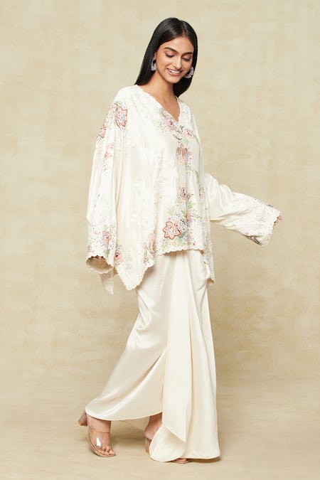 Anamika Khanna Ivory Silk Embroidery V-neck Cape Top And Skirt Set at Aza Fashions Anamika Khanna_Ivory Silk Embroidery V-neck Cape Top And Skirt Set_at_Aza_Fashions