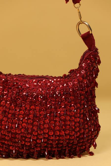 Modarta Red Sequins, Beads Embroidered Tasseled Potli Bag at Aza Fashions Modarta_Red Sequins, Beads Embroidered Tasseled Potli Bag _at_Aza_Fashions