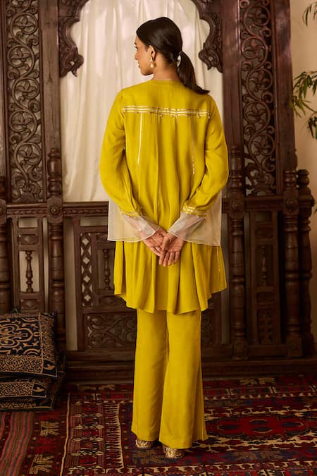 Shop Inej Yellow Cotton, Silk Sequins, Tassels Embroidered Asymmetric Kurta With Pant at Aza Fashions Shop_Inej_Yellow Cotton, Silk Sequins, Tassels Embroidered Asymmetric Kurta With Pant _at_Aza_Fashions