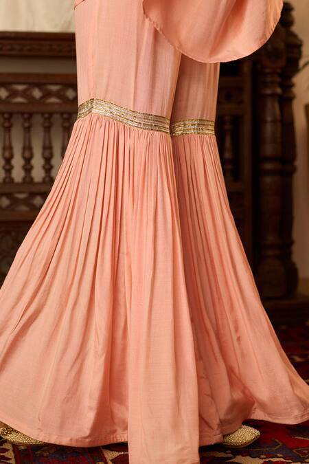 Inej Peach Cotton, Silk Sequins, Tassels Round Neck Embroidered Kaftan And Gharara Set at Aza Fashions Inej_Peach Cotton, Silk Sequins, Tassels Round Neck Embroidered Kaftan And Gharara Set _at_Aza_Fashions