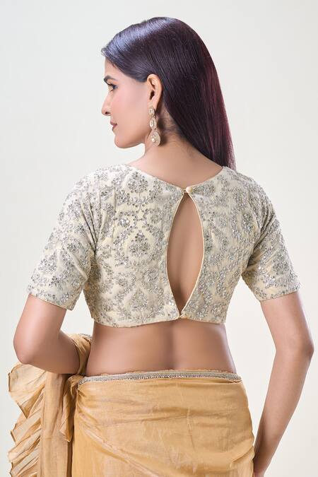 Shop Samyukta Singhania Cream Net Sequins, Zari Round Neck Embroidered Saree Blouse at Aza Fashions Shop_Samyukta Singhania_Cream Net Sequins, Zari Round Neck Embroidered Saree Blouse_at_Aza_Fashions