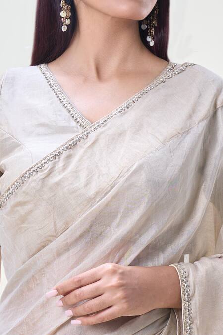 Samyukta Singhania_Beige Tissue Zari, Stones V-neck Embroidered Saree With Blouse_at_Aza_Fashions