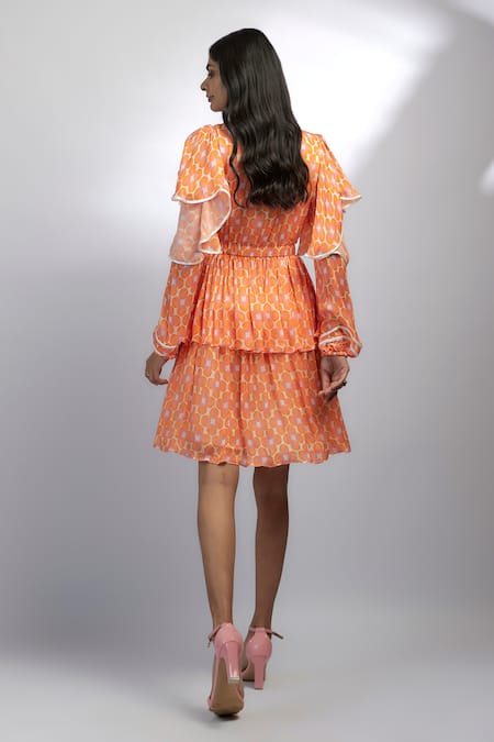 Shop Ewoke Orange Chiffon Round Neck Tangelo Mini Ruffle Dress at Aza Fashions Shop_Ewoke_Orange Chiffon Round Neck Tangelo Mini Ruffle Dress _at_Aza_Fashions