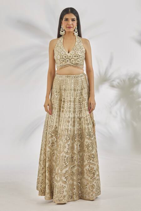 Shop Vandana Sethi Ivory Silk Crystals, Mirrors Halter Neck Embellished Floral Lehenga Set Online at Aza Fashions Shop_Vandana Sethi_Ivory Silk Crystals, Mirrors Halter Neck Embellished Floral Lehenga Set _Online_at_Aza_Fashions