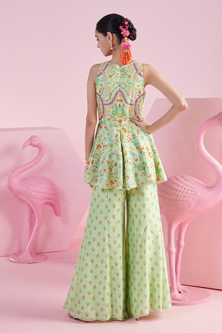 Shop Mandira Wirk - Indian Green Chanderi, Chiffon Sequins, Nevin Floral Print Peplum Top Flared Pant Set at Aza Fashions Shop_Mandira Wirk - Indian_Green Chanderi, Chiffon Sequins, Nevin Floral Print Peplum Top Flared Pant Set _at_Aza_Fashions