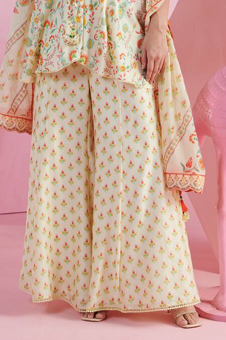 Mandira Wirk - Indian Ivory Chanderi Sequins, Beads, Embroidery Imaya Printed Peplum Top Sharara Set Online at Aza Fashions Mandira Wirk - Indian_Ivory Chanderi Sequins, Beads, Embroidery Imaya Printed Peplum Top Sharara Set _Online_at_Aza_Fashions