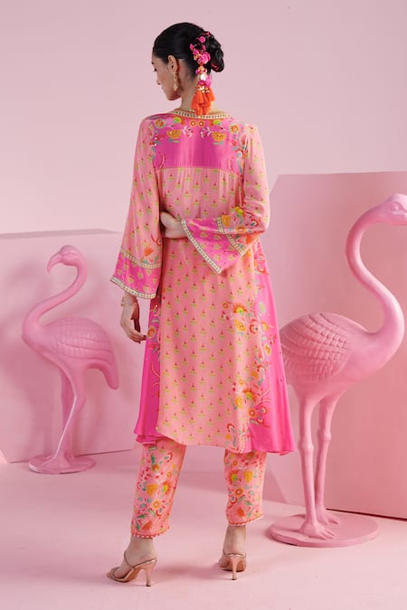 Shop Mandira Wirk - Indian Pink Crepe Tassels, Embroidery V-neck Aseem Asymmetric Kurta And Pant Set at Aza Fashions Shop_Mandira Wirk - Indian_Pink Crepe Tassels, Embroidery V-neck Aseem Asymmetric Kurta And Pant Set _at_Aza_Fashions