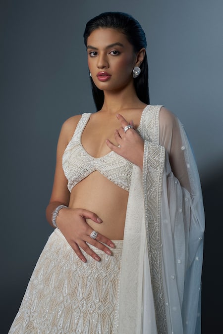 Ritika Mirchandani_Ivory Crepe Embroidered Crystal Plunging Lehenga Set _Online_at_Aza_Fashions