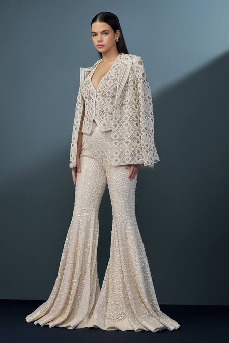 Ritika Mirchandani_Ivory Net, Crepe, Georgette Illume Cutwork Embellished Mesh Blazer Sharara Set _Online_at_Aza_Fashions